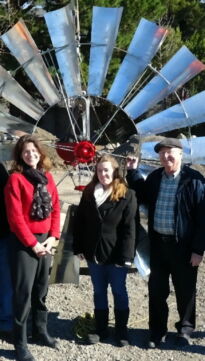 Group in front of Farm Windmill at museum