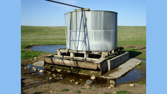 Old metal windmill tank