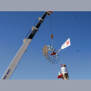 Lifting windmill with sign truck