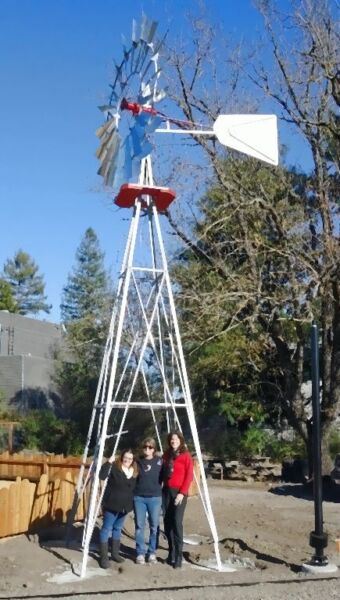 The 8’ windmill looks larger on the 21’ tower